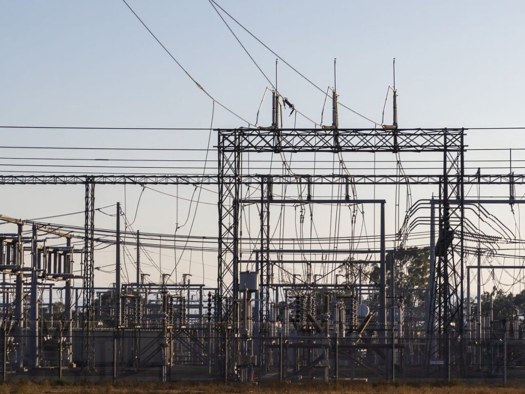 High-voltage electrical substation with steel structures and power lines