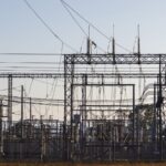 High-voltage electrical substation with steel structures and power lines