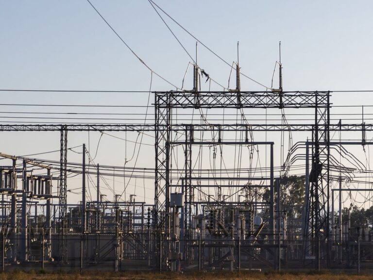 High-voltage electrical substation with steel structures and power lines
